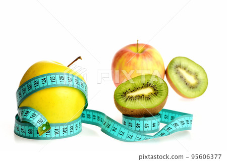 Apple fruit belted around with bright blue measure tape Apple fruit belted around with bright blue measure tape 95606377