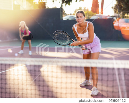 Woman tennis player training on court 95606412
