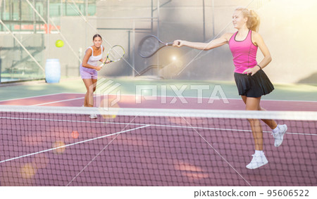 Woman tennis player training on court 95606522