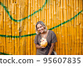 Young Woman on Vacation Drink Coconut Juice 95607835
