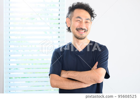 An image of a veteran doctor wearing a surgical gown with copy space 95608525