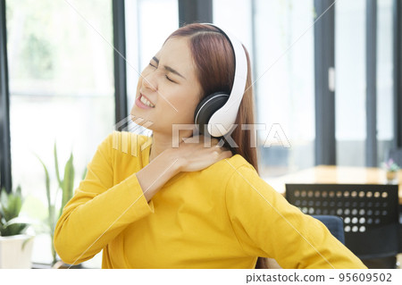 Young woman having back pain from office syndrome. Young woman having back pain from office syndrome. 95609502