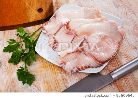 Raw seafood, fresh tiger shark fillet on board Raw seafood, fresh tiger shark fillet on board 95609643
