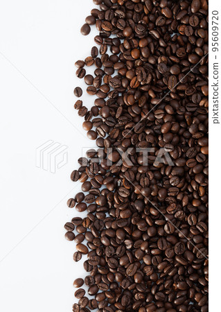 Coffee beans on white surface Coffee beans on white surface 95609720