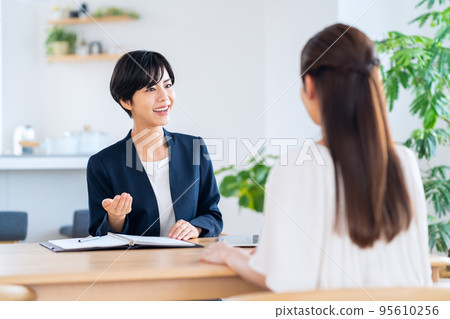 Female consultant living room insurance finance sales 95610256