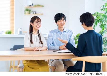 Husband and wife couple family consultant living room insurance finance sales Husband and wife couple family consultant living room insurance finance sales 95610263