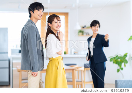 Husband and wife couple family real estate living room sales 95610279