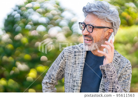 Balancing a rich life in nature Stylish business person Smartphone Remote work Balancing a rich life in nature Stylish business person Smartphone Remote work 95611563