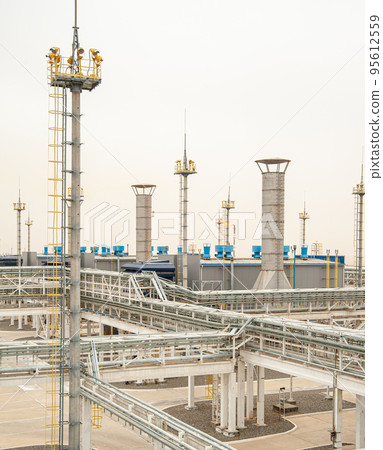 An oil and gas engineering and industrial construction. Panorama of the factory 95612559