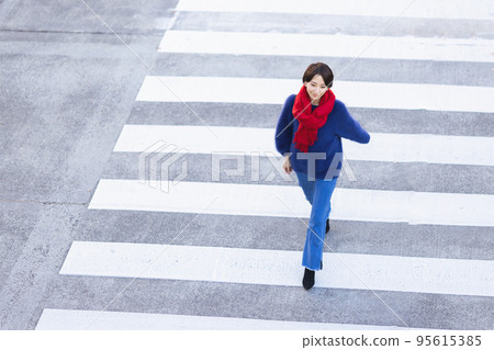 A woman walking in the city 95615385
