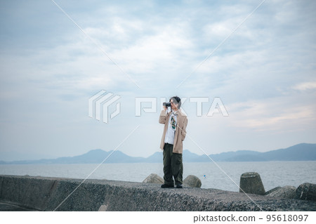 A man with a camera A man with a camera 95618097