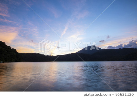 Sunset reflected in Miike and Mt. Takachiho 95621120
