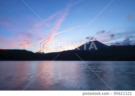 Sunset reflected in Miike and Mt. Takachiho Sunset reflected in Miike and Mt. Takachiho 95621122