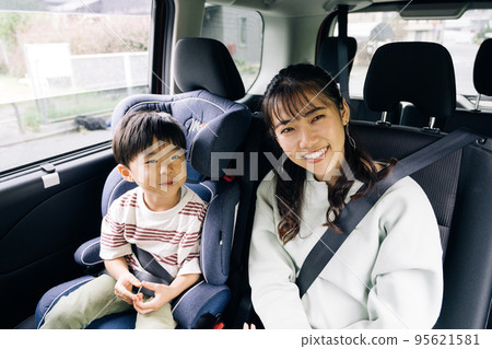 Family image driving with a boy 95621581