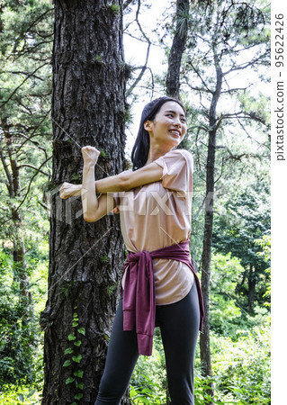korean young woman hiking and plogging__stretching korean young woman hiking and plogging__stretching 95622426