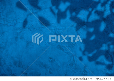 Shadow of leaves on blue concrete wall texture background Shadow of leaves on blue concrete wall texture background 95623627