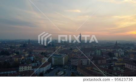 Aerial drone view of misty Cremona, Lombardy Italy medieval center at sunrise Aerial drone view of misty Cremona, Lombardy Italy medieval center at sunrise 95623730