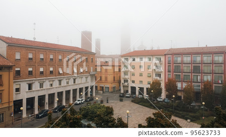 foggy cityscape aerial drone view of town center Cremona, Lombardy, Italy 95623733