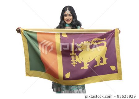 Woman holding the Sri Lanka flag 95623929