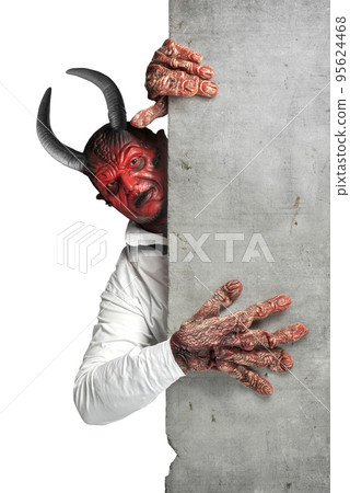 Devilman standing behind the wall 95624468