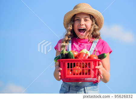 Selling homegrown food concept. Natural vitamin nutrition. Vegetables market. Organic vegetables. Girl cute child farming. Gathering vegetables in basket. Village rustic style. Sunny day at farm Selling homegrown food concept. Natural vitamin nutrition. Vegetables market. Organic vegetables. Girl cute child farming. Gathering vegetables in basket. Village rustic style. Sunny day at farm 95626832