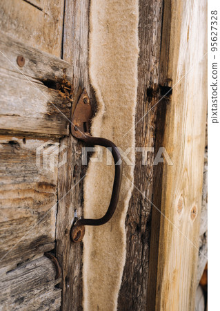 wooden barn door with handle. old wooden buildin wooden barn door with handle. old wooden buildin 95627328
