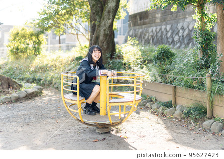 High school girl on her way home after school High school girl on her way home after school 95627423