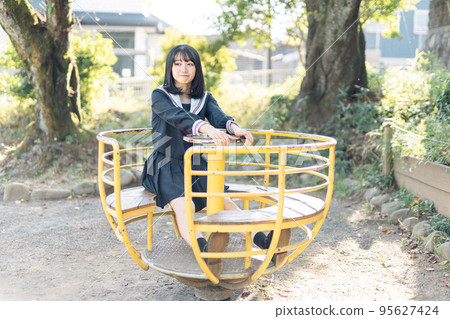 High school girl on her way home after school High school girl on her way home after school 95627424