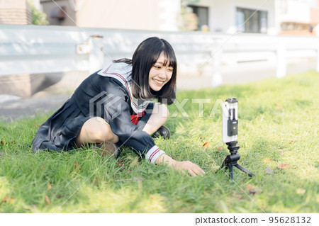 High school girl taking a video 95628132
