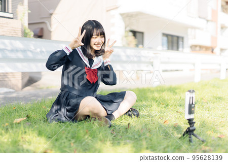 High school girl taking a video 95628139