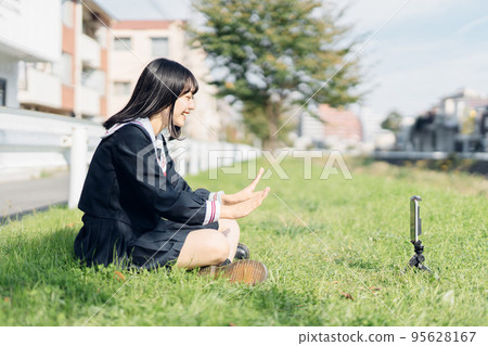 High school girl taking a video High school girl taking a video 95628167