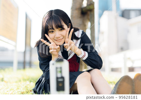High school girl taking a video High school girl taking a video 95628181