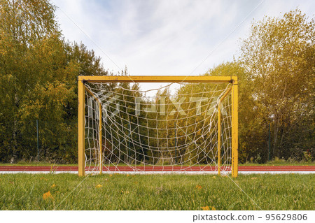 Front view of a small yellow football goals 95629806