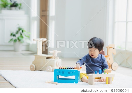 1 year old boy playing with toys 1 year old boy playing with toys 95630094