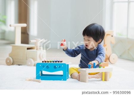 1 year old boy playing with toys 1 year old boy playing with toys 95630096