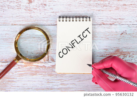 CONFLICT the text on the notebook written in pencil CONFLICT the text on the notebook written in pencil 95630132