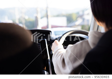 Mrs driver driving a car 95630403