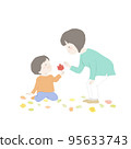 A child showing his mother the fallen leaves he picked up 95633743
