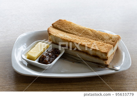 Traditional Chinese sandwich toast bread served with butter and jam 95633779