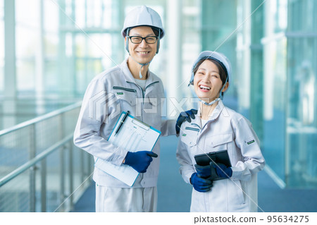 General affairs department in work clothes doing an evacuation drill 95634275