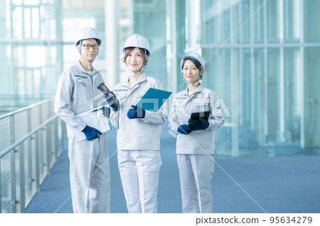 Engineers in work clothes working in a state-of-the-art development center 95634279