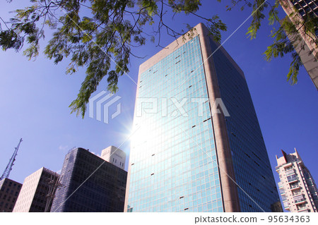 Glass-walled building in Sao Paulo and blue sky Brazil Glass-walled building in Sao Paulo and blue sky Brazil 95634363