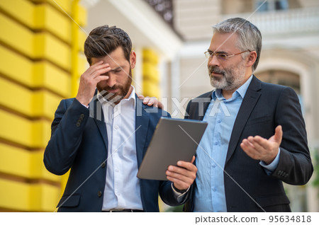 Boss discussing project development with the manager Boss discussing project development with the manager 95634818