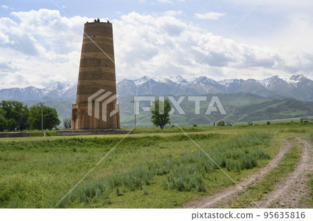 Burana Tower minaret of 9 century in ancient Karakhanid state in the mountains in Kyrgyzstan Burana Tower minaret of 9 century in ancient Karakhanid state in the mountains in Kyrgyzstan 95635816
