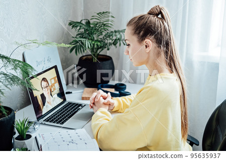 Young woman student applicant having online virtual video call job interview meeting with female hr recruiter or employer. Distance remote recruitment conference chat Young woman student applicant having online virtual video call job interview meeting with female hr recruiter or employer. Distance remote recruitment conference chat 95635937