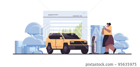 woman charging electric suv in mobile app battery vehicle at recharging power station charger EV management zero emission 95635975