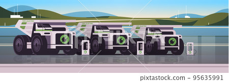 electric mining dumpers industrial trucks charging parking at the charger station with a plug in cable electrified transportation 95635991