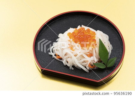 New Year dishes 20-02 _ red and white eggplant with how much on a black plate _ background gold 95636190