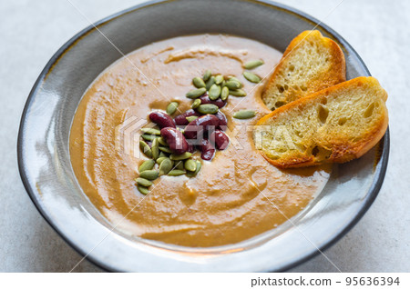 Healthy pumpkin soup with beans Healthy pumpkin soup with beans 95636394