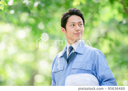 Male portrait in helmet work clothes 95636480